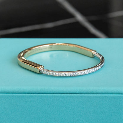 Tiffany & Co. Two Tone Bangle With Half Diamond Pave