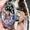 Side picture of a Rolex 116710 batman showing the crown